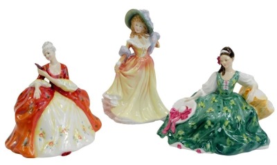 Three Royal Doulton porcelain figures, modelled as Whistful HN2396, Katie HN3360, and Elyse HN2474.