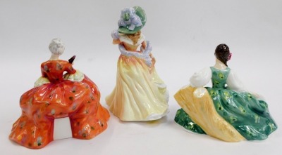 Three Royal Doulton porcelain figures, modelled as Whistful HN2396, Katie HN3360, and Elyse HN2474. - 2