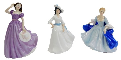 Three Royal Doulton porcelain figures, modelled as Margaret HN2397, Dulcie HN2305, and Bells Across the Valley HN4300.