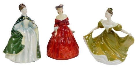 Three Royal Doulton porcelain figures, modelled as Premier HN2342, Lynn HN2329, and Vivienne HN2073.