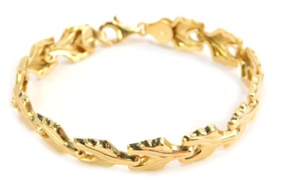 A fancy link bracelet, with Y shaped floral links, with hammered ends, yellow metal stamped 585, 18cm long, 8.3g, boxed.