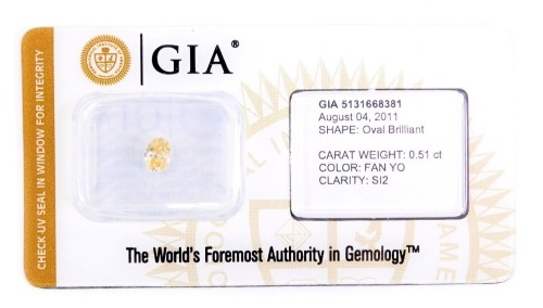 A fancy yellow orange diamond loose stone, with GIA certificate stating 0.51ct SI2.