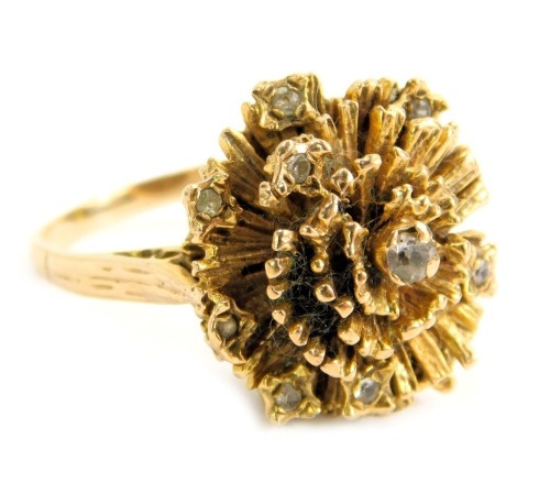 A 9ct gold dress ring, the abstract brushed design ring head set with round brilliant cut stones, maker HM, London 1932, ring size K½, 7g all in.,