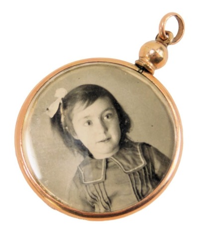 A Victorian rolled gold locket, 3cm high.