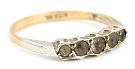 A five stone dress ring, set with five imitation diamonds in a rub over white metal setting on a yellow metal band, stamped 9ct Sil, size N 1/2, 2.1g all in.