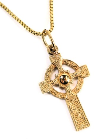 A 9ct gold crucifix pendant, of heavy design, 3cm high, 5.3g, on a plated chain.