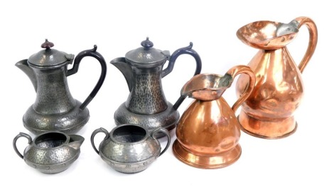 Pewter and copper wares, comprising a copper flagon, 20cm high, and small flagon, 13cm high, and a four piece Craftsman coffee set, with hammered design. (6)