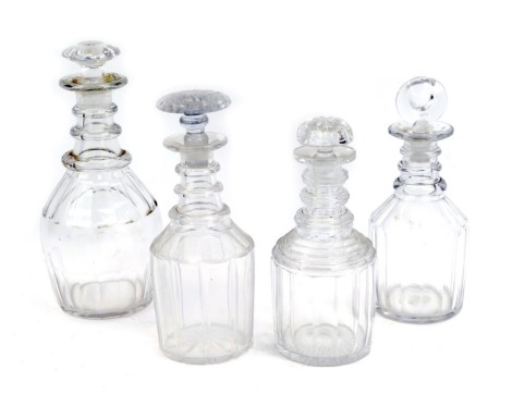 Four Victorian and later cut glass decanters, a fluted mallet shaped decanter, one with star cut base, the largest 27cm high. (4)