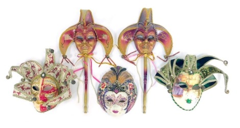 A group of Venetian Carnival masks, each elaborately decorated with glitter. (5)