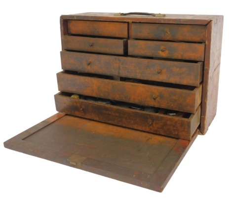 A wooden carpenter's chest and contents of tools, including drill bits, chisels, lathe parts, etc., 43cm high, 61cm wide, 22cm deep. (1 box)