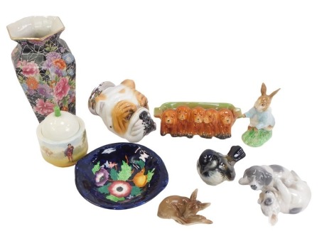 A group of 20thC ceramics, comprising a Goebel bird, a Royal Copenhagen puppy figure group, a Royale Stratford stirrup cup formed as a dog with a silver plated collar, a Beswick dog pen tray, a seated fawn, Beswick Beatrix Potter Peter Rabbit, Royal Doult