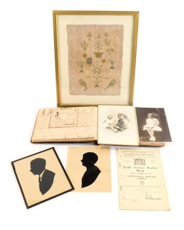 A Georgian sampler fragment, depicting birds and flowers, 20cm x 14cm, framed, two silhouette portraits, and an autograph book, etc. (a quantity)