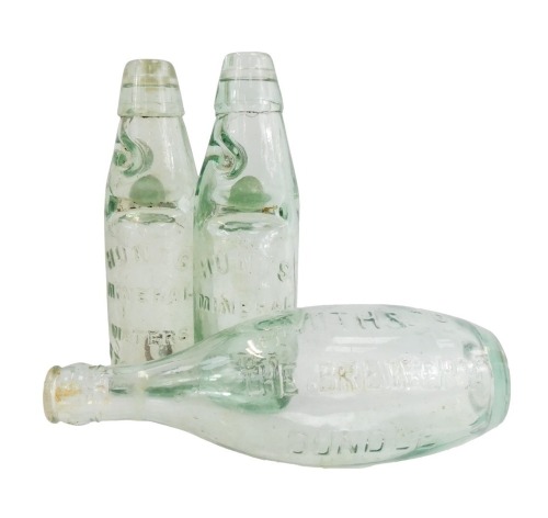 A group of Lincolnshire related glass bottles, comprising two Hunt's Mineral Water Stamford, and a Smith and Co Brewery Oundle bottle, 20cm high. (3)