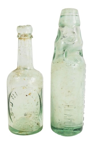 Two Lincolnshire related glass bottles, comprising Lee and Green Limited Boston and Sleaford, and a J Nickolls and Co of Sleaford, 23cm and 20cm high. (2)