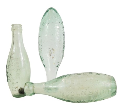 Three 19thC glass bottles, comprising two RM Mills and Co of Bourne Lincolnshire, and an RM Mills and Co of Bourne, 21cm and 19cm high. (3)