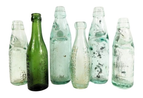 Six Cambridgeshire related glass bottles, comprising Saunders Limited of Peterborough, Cutlack and Harlock of Peterborough, TG Smith Peterborough with Cathedral, Sobrite Peterborough, HW Becks and Co, the largest 23cm high. (6)