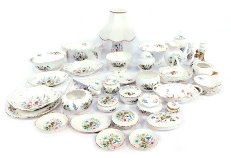 A group of Aynsley porcelain decorated in the Wild Tudor pattern, including dressing table jars, plates, baskets, a vase, atomiser, centre bowls, etc. (3 trays plus)