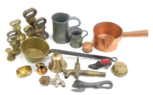 A group of copper and brass wares, including brass weights, copper milk pan, bean slicer, miniature bell, pewter tankard, etc. (1 tray)