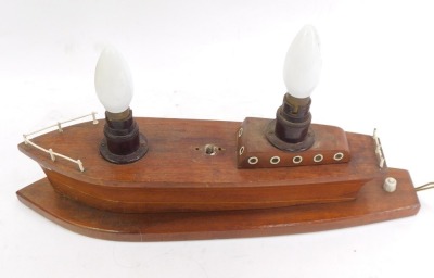 A 20thC table lamp modelled as a wooden boat, 44cm wide.Buyer Note: WARNING! This lot contains untested or unsafe electrical items. It is supplied for scrap or reconditioning only. TRADE ONLY  - 2