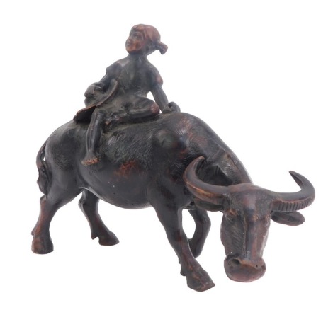 An early 20thC Chinese carved wooden figure group, of the boy on the buffalo, 17cm high. (AF)