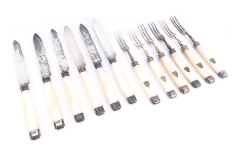 A set of six Victorian silver and mother of pearl handled fruit knives and forks, the handles with vacant silver shield, Harrison Bros & Howson, Sheffield 1900.