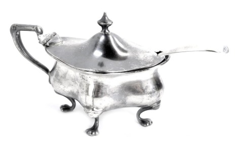 A silver mustard pot, of shaped and fluted form, on four paw feet, and blue glass liner, Walker & Hall, Sheffield, date mark rubbed, together with a George III silver mustard spoon, 2.19oz.