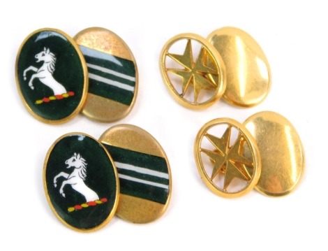 Two pairs of cufflinks, comprising a star design oval link cufflink, with chain link, gold coloured, unmarked, and a pair of gold plated and enamel green crested cufflinks.