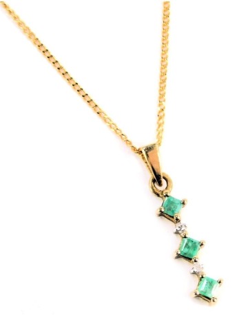 A 9ct gold emerald and CZ set pendant and chain, the layered pendant set with three emeralds and two tiny CZs, 2cm high, on fine link neck chain, 1.7g all in, 46cm long.