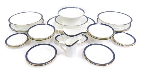 A Wedgwood porcelain Midnight pattern part dinner service, comprising an oval meat plate, milk jug, gravy boat and saucer, six bowls, serving bowl, three oval tureens, six dinner plates, six side plates and six medium plates.