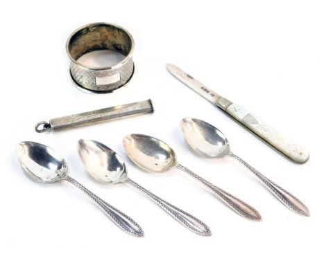 Silver and other trinkets, comprising a set of four silver teaspoons, each with zigzag border, Birmingham 1941, a white metal napkin ring, unmarked, a silver and mother of pearl penknife and a Samson Mordan and Company propelling pencil, 3.18oz. (7)