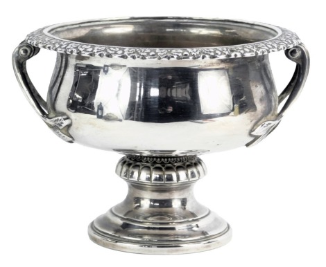 An Elizabeth II silver twin handled bowl, with leaf cast border and handles, on a domed foot, Birmingham 1952, 8.37oz.