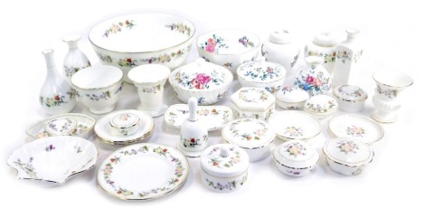 Wedgwood Porcelain Mirabelle and Avebury pattern wares, including part dressing table sets, trinket jars and covers, bud vases, centre bowl, hexagonal bowl, etc. (2 trays)