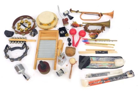 Various musical instruments, including two tambourines, maracas, shakers, bells, brass trumpet, etc. (1 tray)