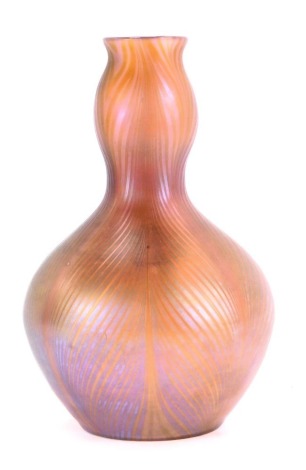 A Loetz style glass vase, of double gourd form decorated in silver lustre on a white ground, 22cm high.