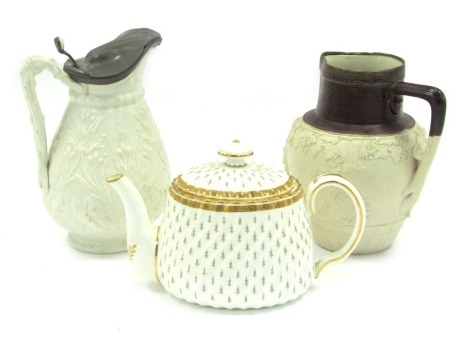 Collector's ceramics, comprising a Mintons ceramic teapot, with gilded star and dotted detail, 13cm high, a Royal Doulton Parian ware style jug, with pewter top, 19cm high, and a John Turner Basalt ware jug, with silver plated rim, 18cm high. (3)