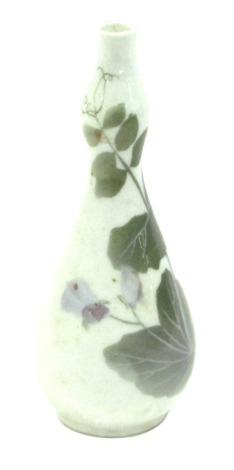 A Royal Copenhagen double gourd vase, on a white ground with floral decoration, 22cm high.