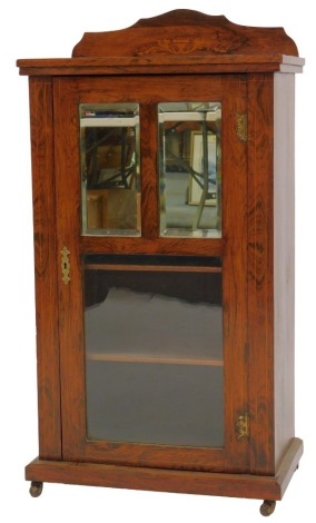 A late 19thC rosewood and line inlaid music cabinet, the top with a raised back above a door with two mirrored panels and glass section to base, enclosing various shelves, on plinth base with castors, 101cm high, 56cm wide, 34cm deep.