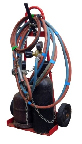 An acetylene torch set, including trolley, canisters, pipes and torch.