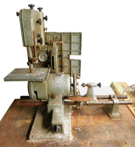 An Emcostar 6 in 1 woodworking machine, including a lathe, a band saw, a sander, etc.Buyer Note: WARNING! This lot contains untested or unsafe electrical items. It is supplied for scrap or reconditioning only. TRADE ONLY 