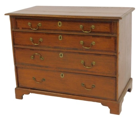 A 19thC oak and mahogany crossbanded chest, the top with a rounded edge above a set of four graduated drawers, on bracket feet, adapted, 77cm high, 100cm wide, 52.5cm deep.