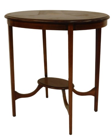 An Edwardian mahogany walnut and inlaid occasional table, the top with cross banding and central inlaid roundel, raised on square legs with oval under tier united by stretchers, 76cm high, the top 73cm x 54cm.