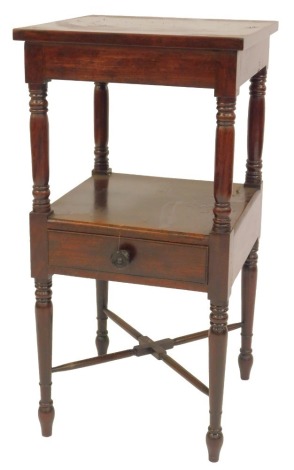 A 19thC mahogany bedside table, the square top raised on turned columns with under tier and frieze drawer, on turned tapering legs united by an X shaped stretcher, 81cm high, 41cm wide, 41cm deep.