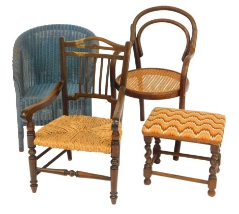 A group of child's furniture, to include a Lloyd Loom style wicker blue painted tub chair, bentwood chair with caned seat, oak framed chair with rush seat, and an oak footstool.