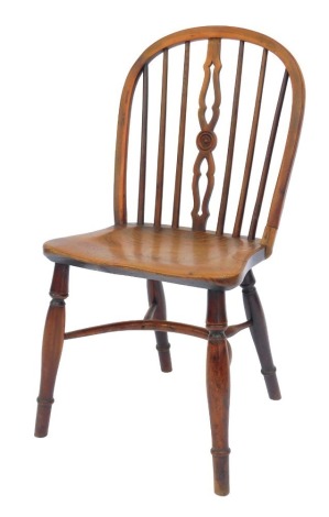 An unusual 19thC yew and elm Windsor side chair, the hoop back joined to the side of the seat, on turned legs with crinoline stretcher. (AF)