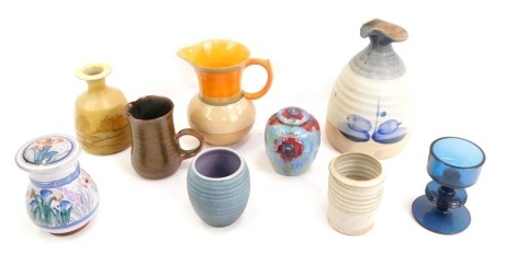 A group of studio pottery, to include a Cobridge stoneware jar and cover decorated with red flowers against a blue and green glazed ground, impressed marks, 10cm high, vase decorated with rural scene, together with a Shelley porcelain jug, glass tealight 