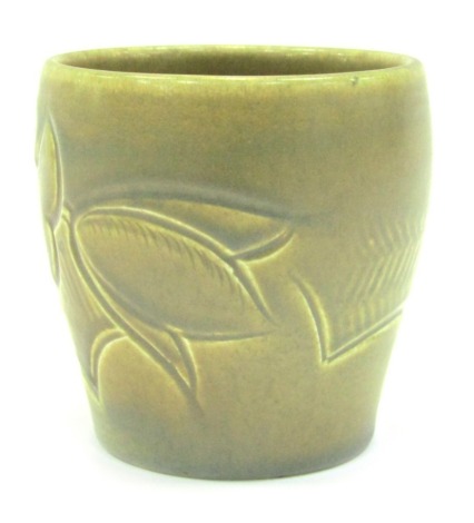 A Suzie Cooper pottery vase c1932, sgraffito decorated with flowers and leaves, with green ground, incised marks, 9cm high.