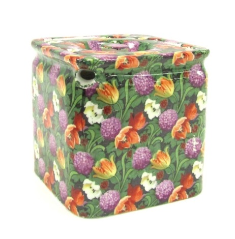 An early 20thC T G Green & Company Ltd The Cube teapot, printed with flowers, printed mark, 10.5cm high.