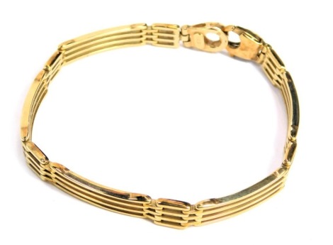 A four row gate bracelet, with rectangular and square cut links, yellow metal stamped 375, 18cm long, 12.3g all in.