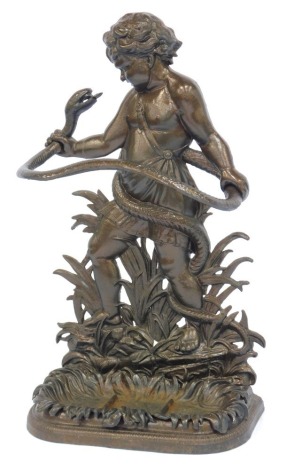 A cast iron stick stand, in Coalbrookdale style, modelled as a young Hercules wrestling snake, 82cm high, 48cm wide.