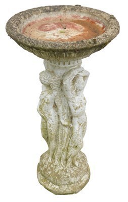 A reconstituted stone Neoclassical birdbath, the oval top on three maiden stem, on octagonal foot, 78cm high, 40cm diameter.